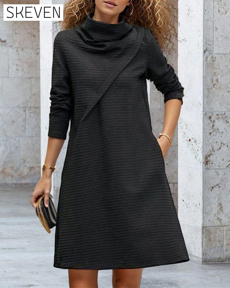 Couture-Kleid mit hohem Kragen und Taschen