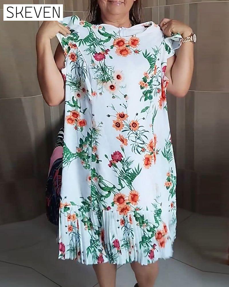 Kleid mit Einsätzen, plissiert und mit Blumenmuster