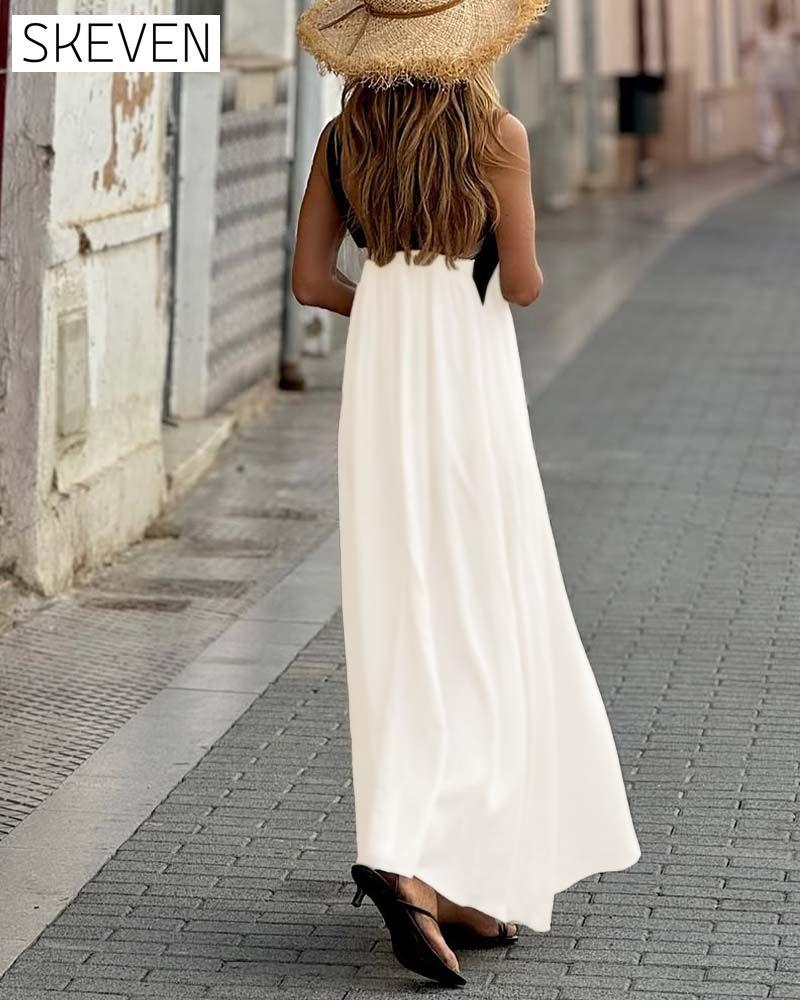 Elegantes Kleid mit gekreuztem Rückenausschnitt und Kontrastfarbe