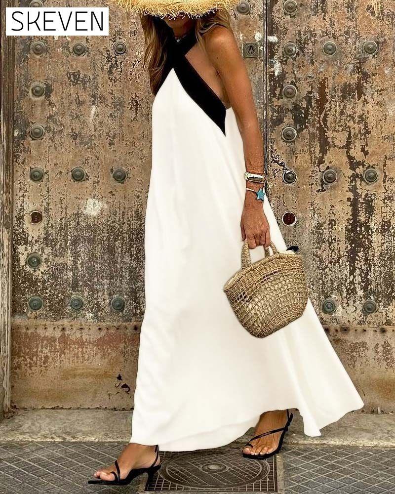 Elegantes Kleid mit gekreuztem Rückenausschnitt und Kontrastfarbe