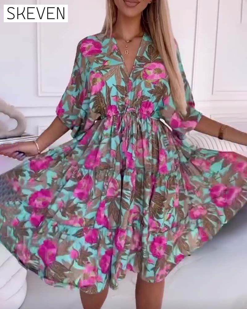 Elegant dress with drawstring ties and floral print