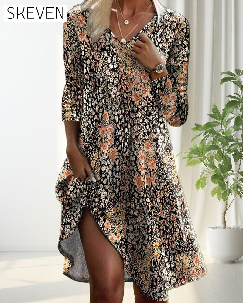 Elegantes Kleid mit langen Ärmeln und Blumenmuster