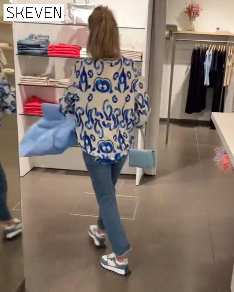 Elegant long-sleeved top with printed V-neck