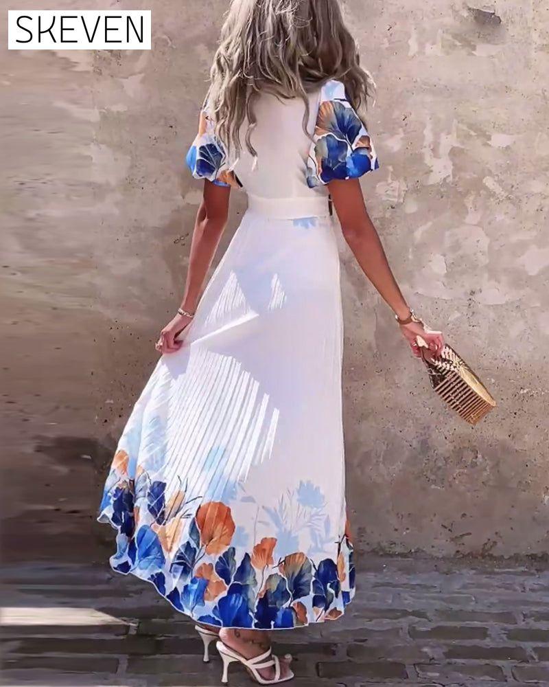 Kleid mit tiefem V-Ausschnitt und bauschigen Ärmeln