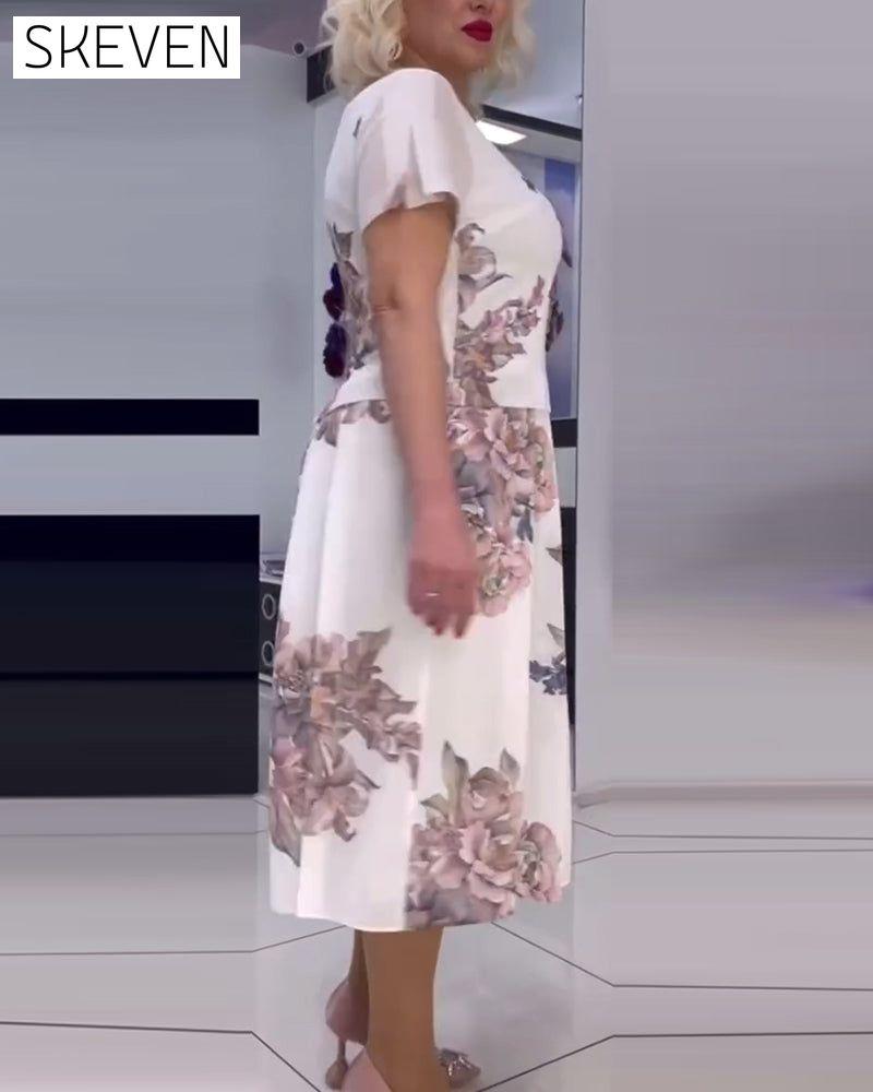 Elegantes Kleid mit Blumenmuster und Rundhalsausschnitt