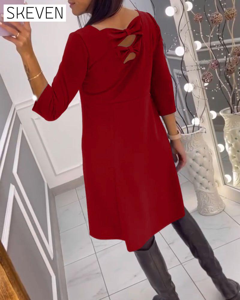 Solid color dress with bow at back
