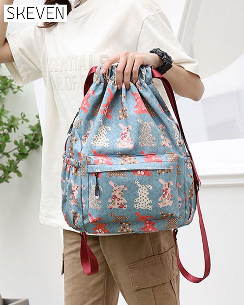 Schultertasche im Ethno-Stil mit Kordelzug
