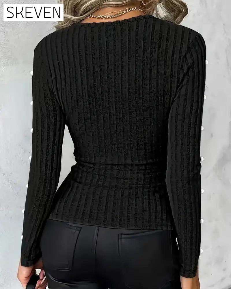 Sexy Stricktop mit V-Ausschnitt und Perlenärmeln