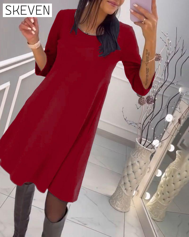 Solid color dress with bow at back