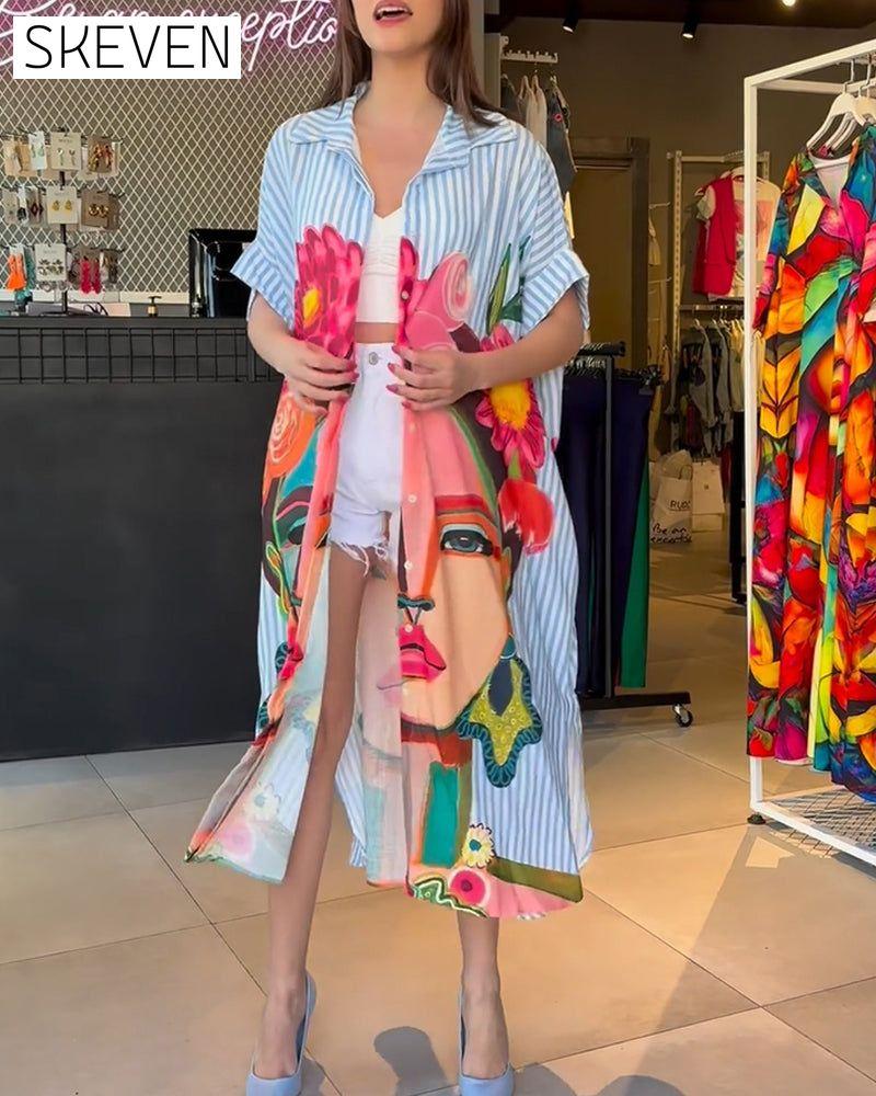 Bluse mit vertikalen Streifen und Charakterprint, Reversschlitz