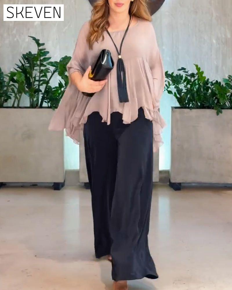 Modische Bluse in Unifarben mit schwungvollem Design