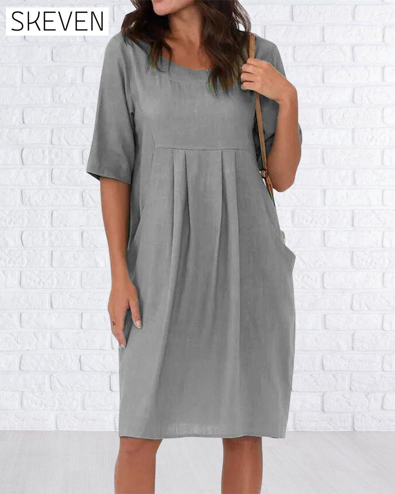 Robe unie à col rond et poches