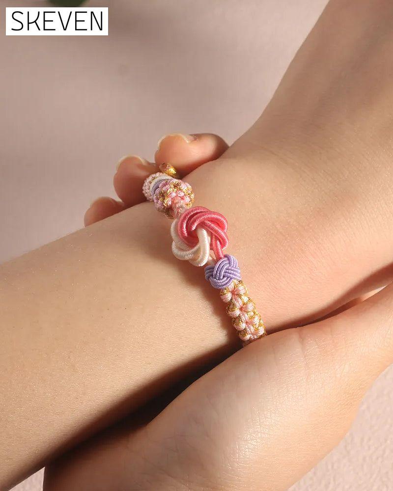 Bracelet with knot of peach blossoms
