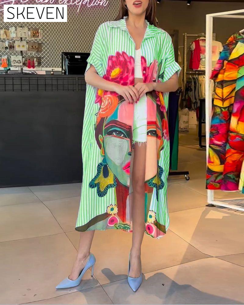 Bluse mit vertikalen Streifen und Charakterprint, Reversschlitz