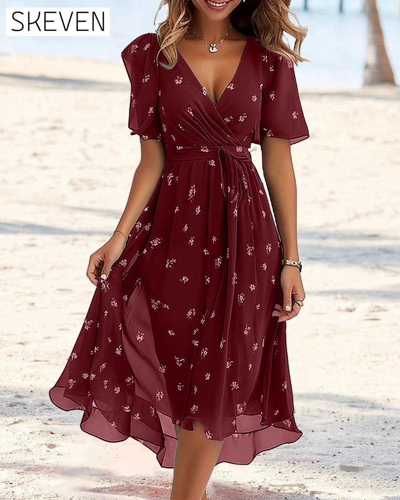 Elegantes bedrucktes Kleid mit Bindeband und V-Ausschnitt
