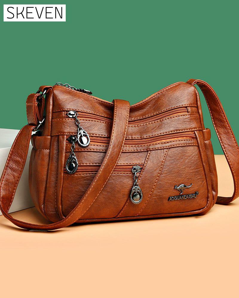 Sac bandoulière en cuir souple multipoches