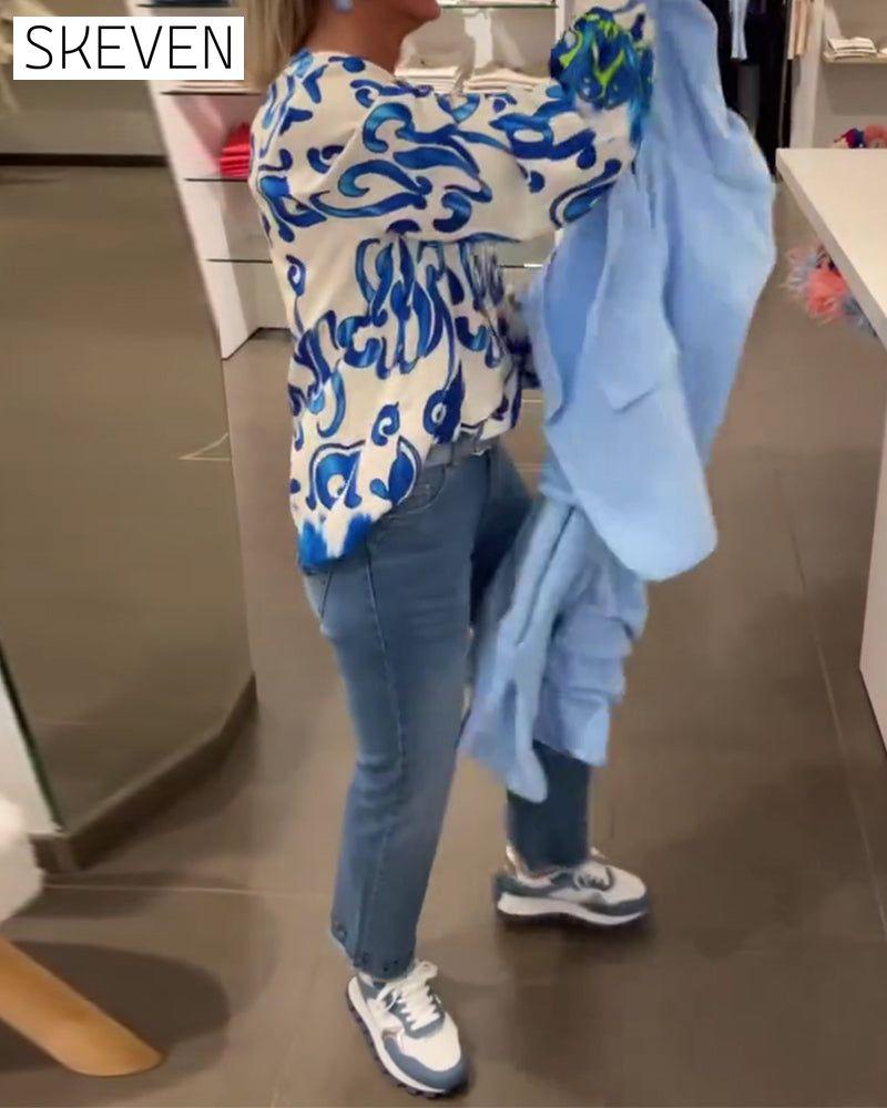 Elegant long-sleeved top with printed V-neck