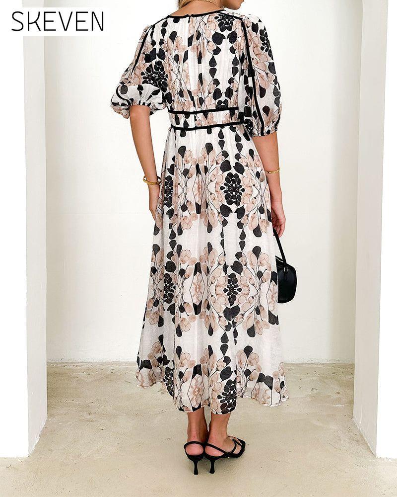 Robe longue élégante à manches bouffantes et imprimé