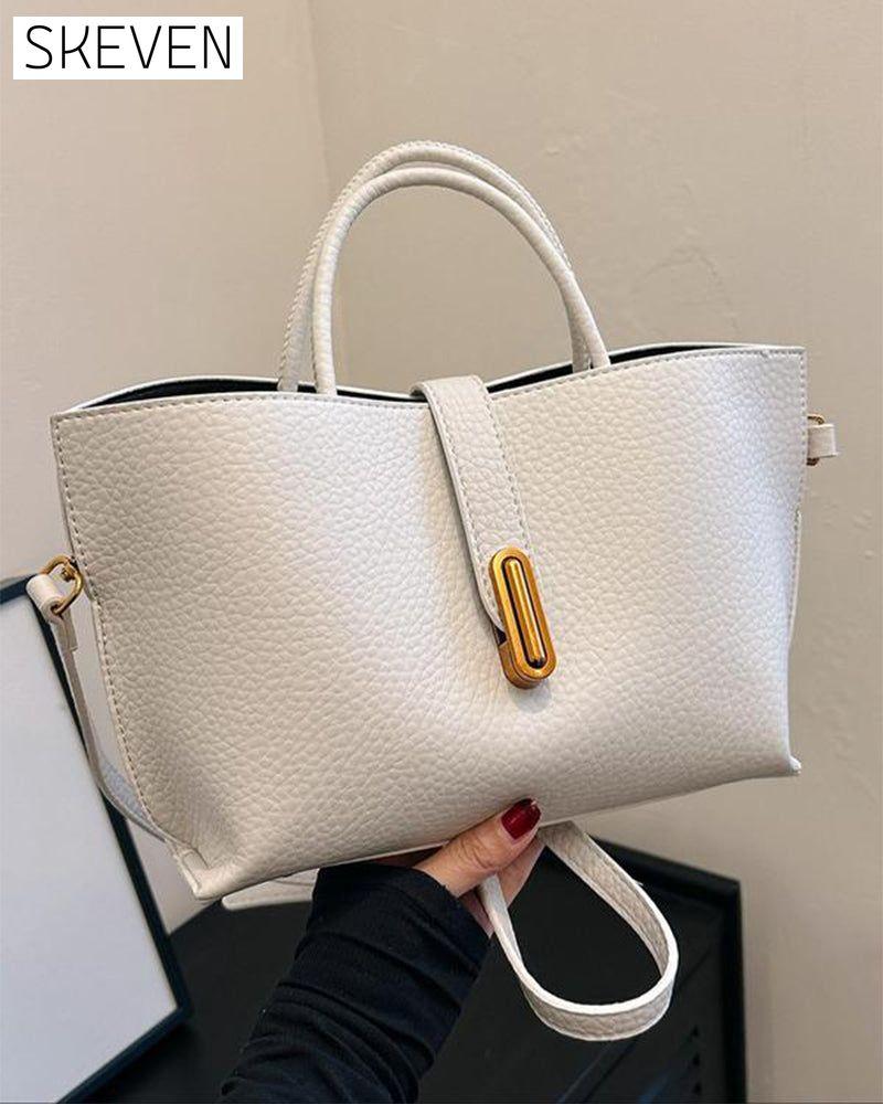 Elegante, einfarbige Damenhandtasche im französischen Stil