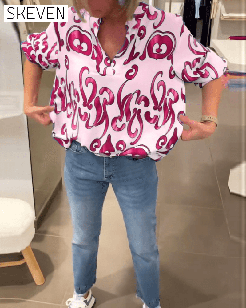 Elegant long-sleeved top with printed V-neck