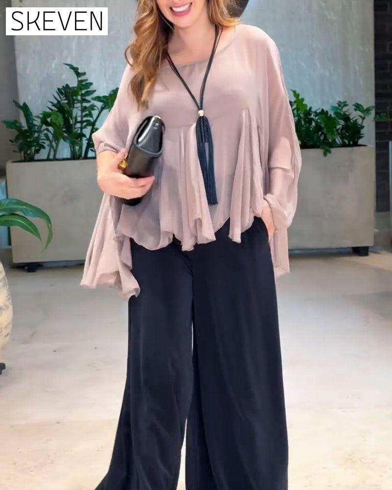 Modische Bluse in Unifarben mit schwungvollem Design