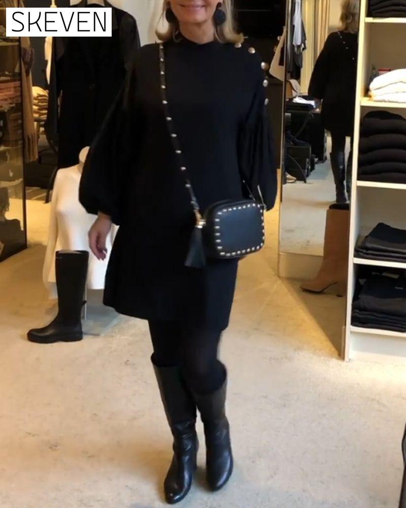 Classic black dress with lantern sleeves