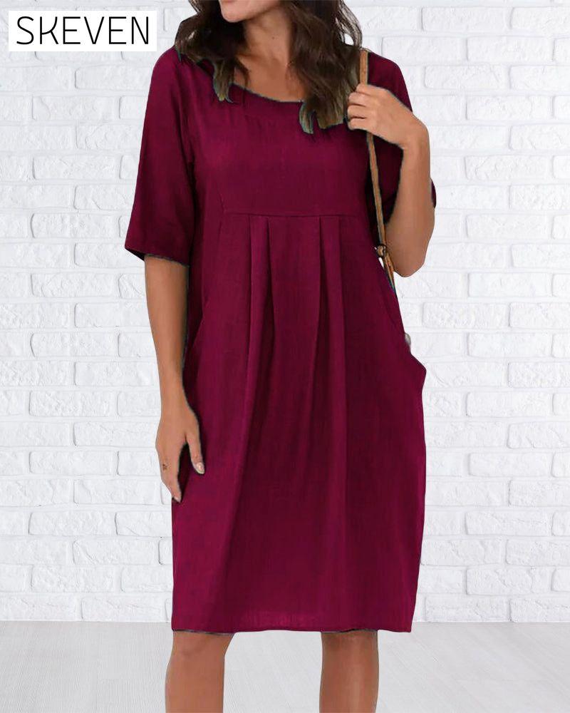 Robe unie à col rond et poches