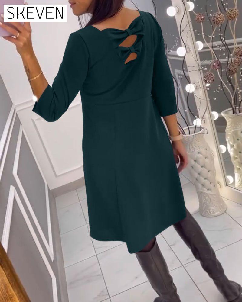 Solid color dress with bow at back
