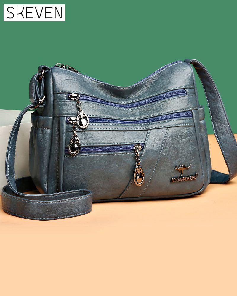 Sac bandoulière en cuir souple multipoches