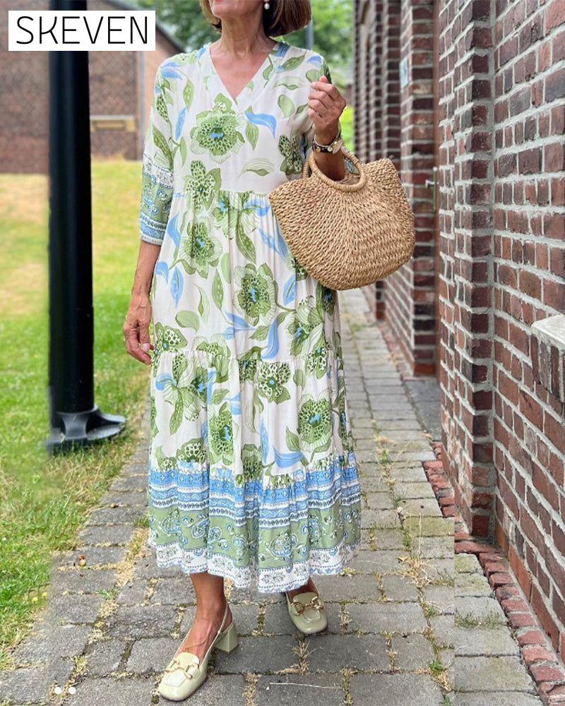Elegantes Kleid mit Blumenmuster und V-Ausschnitt