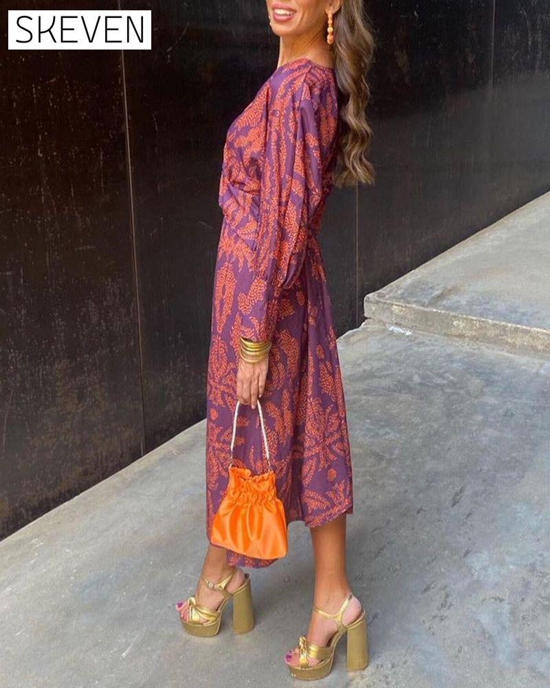 Elegantes Vintage-Kleid mit Print, V-Ausschnitt und langen Ärmeln