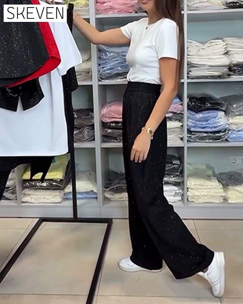 Pantalon élégant à taille haute et jambes larges et brillants