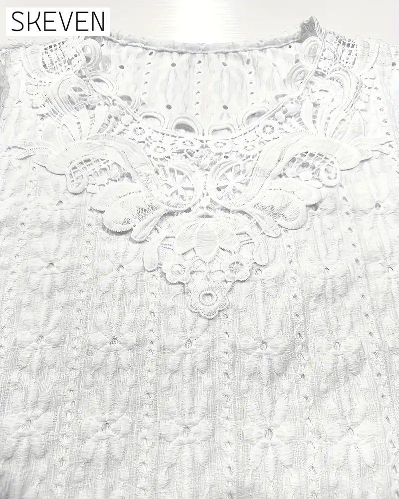 Chemisier à col rond en dentelle crochetée à manches courtes