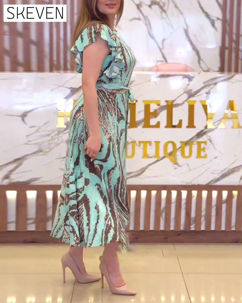 Elegantes Kleid mit Kontrastmuster und Rüschen