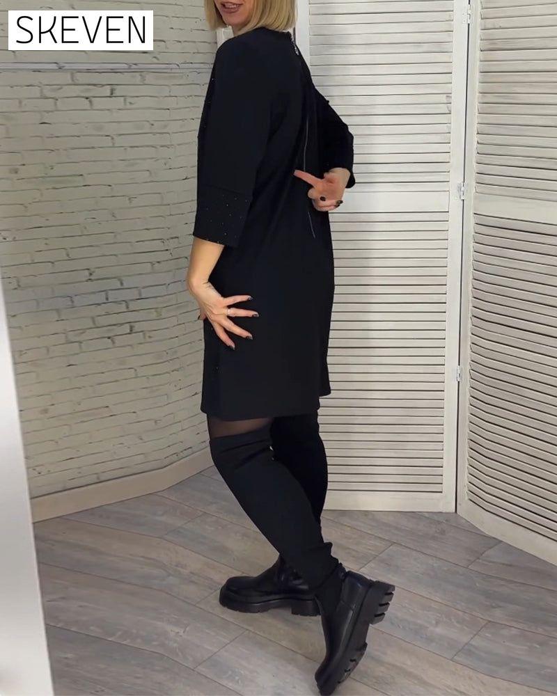 Robe élégante à col en V et manches trois-quarts