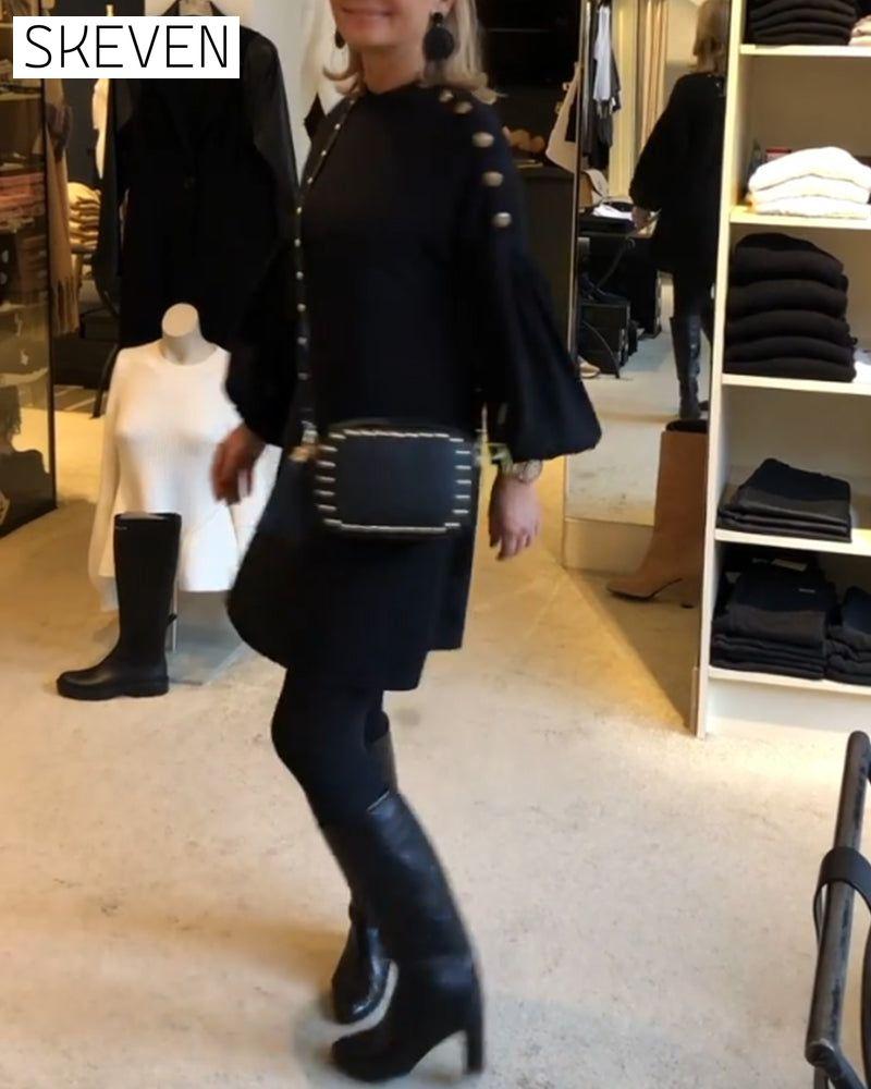 Classic black dress with lantern sleeves