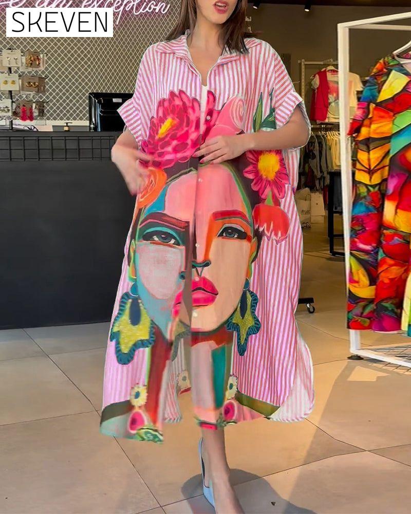 Bluse mit vertikalen Streifen und Charakterprint, Reversschlitz