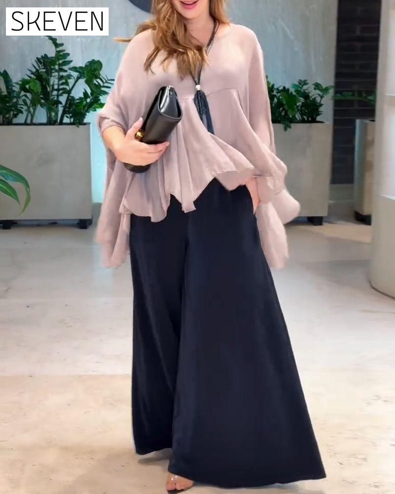 Modische Bluse in Unifarben mit schwungvollem Design