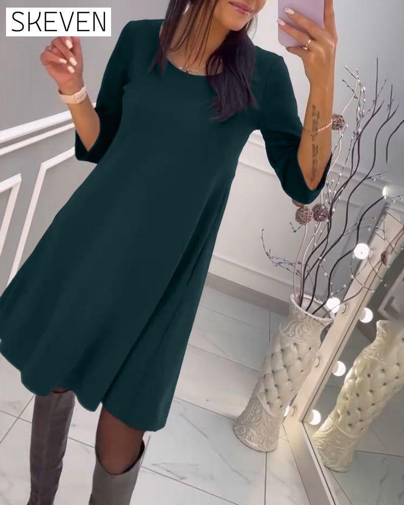 Solid color dress with bow at back