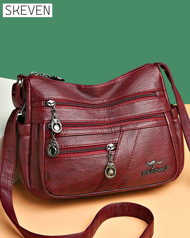 Sac bandoulière en cuir souple multipoches