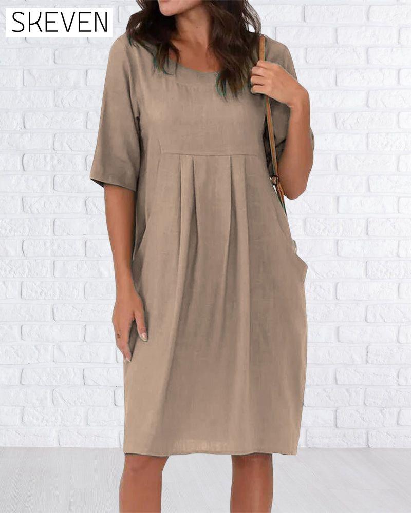 Robe unie à col rond et poches