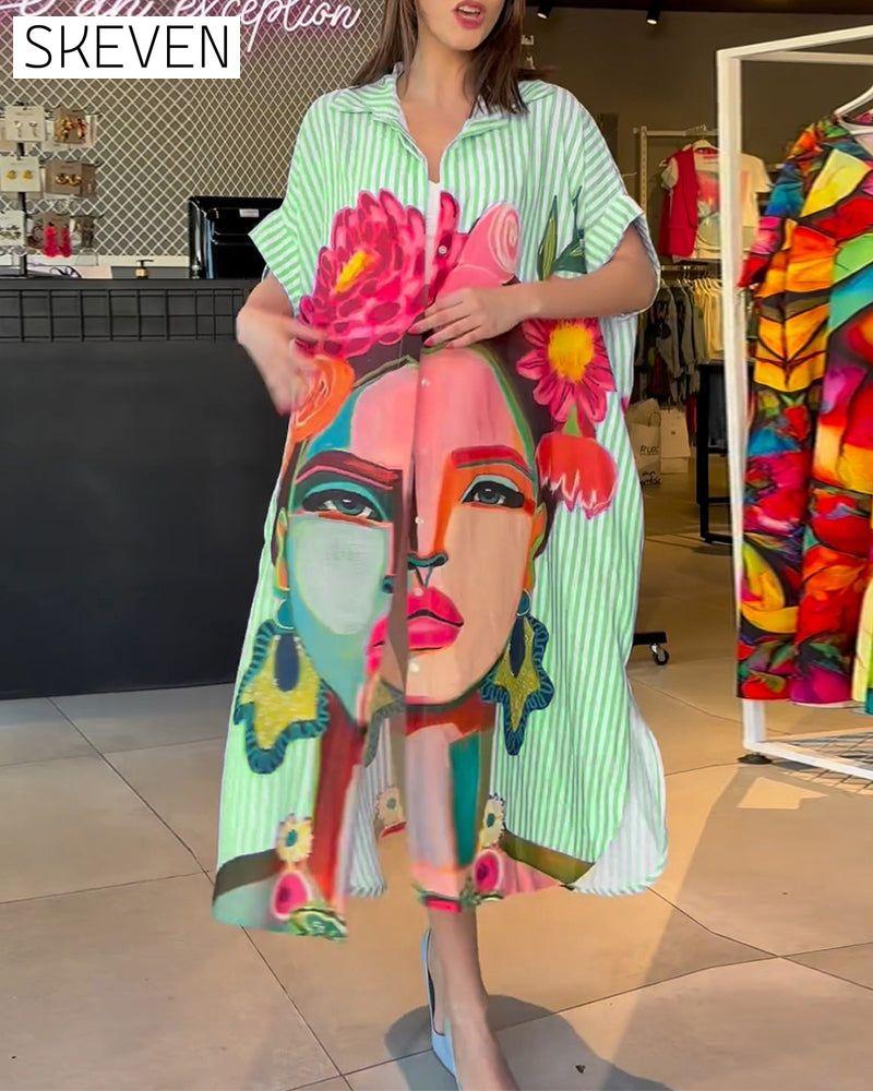 Bluse mit vertikalen Streifen und Charakterprint, Reversschlitz