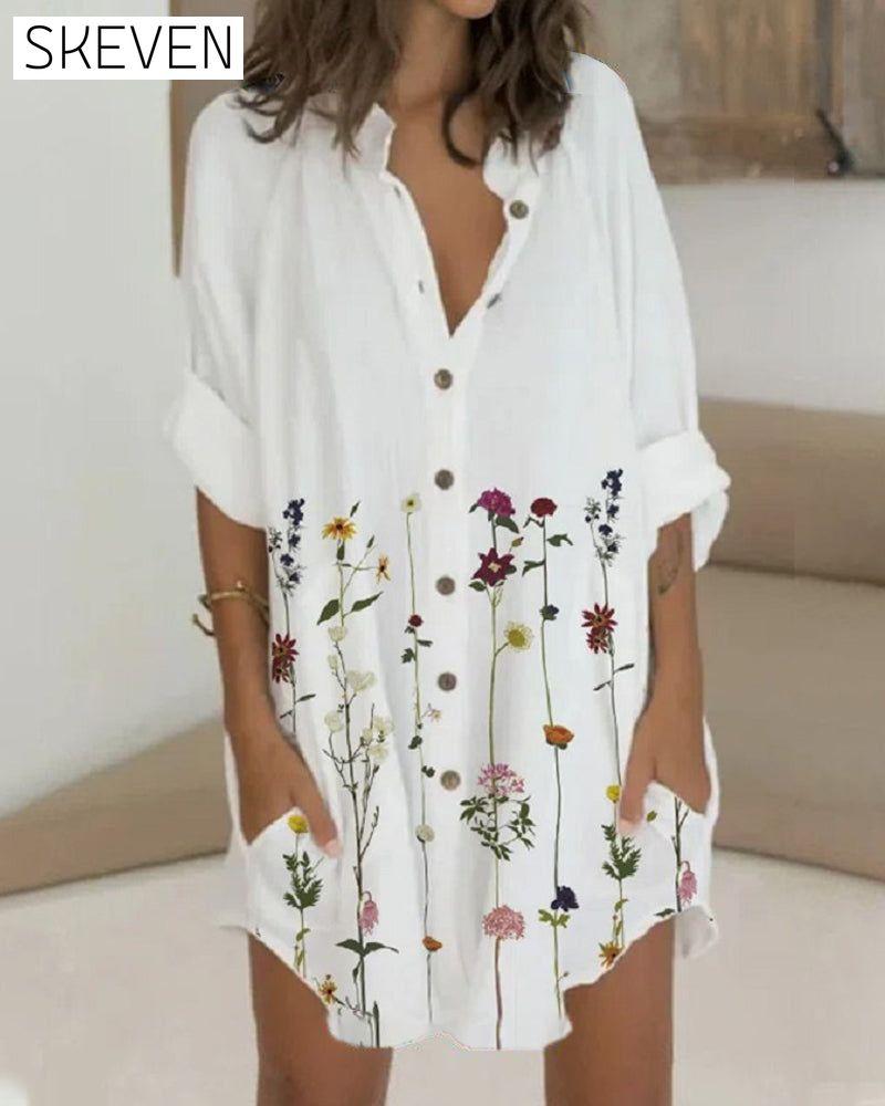 Bedrucktes Kleid mit Knöpfen, langen Ärmeln und Taschen