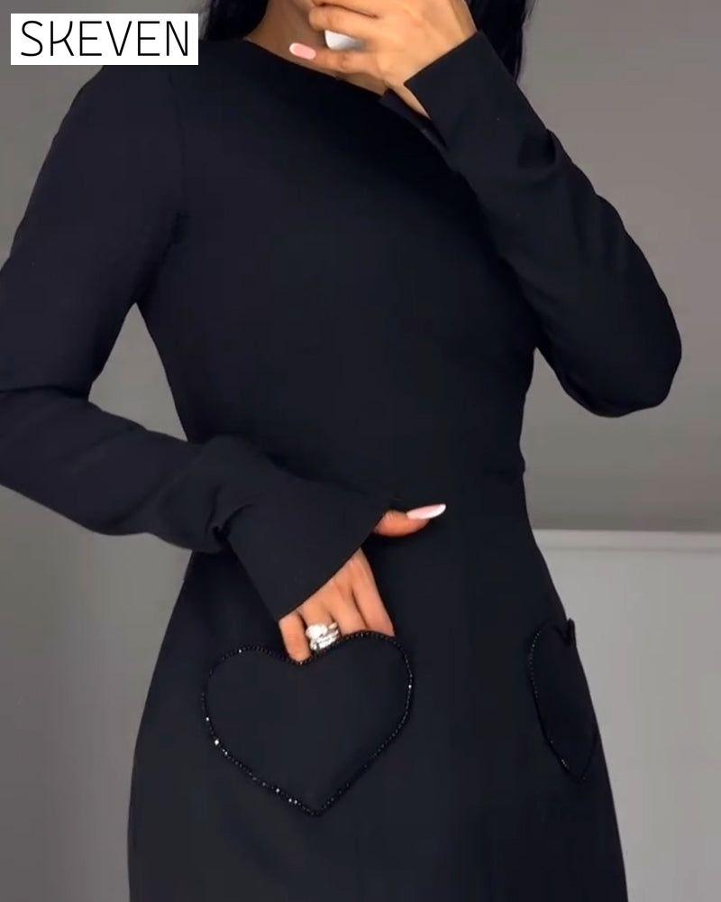 Robe élégante à manches longues cintrée à la taille