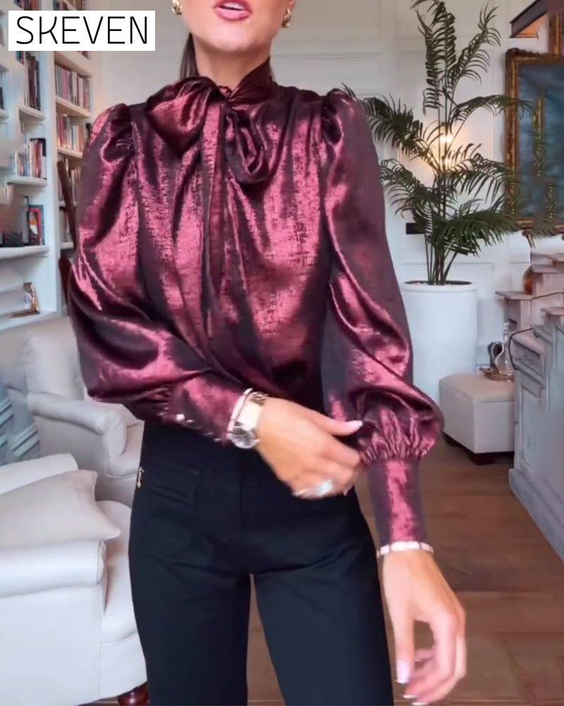 Elegante Bluse mit Puffärmeln und fließendem Band