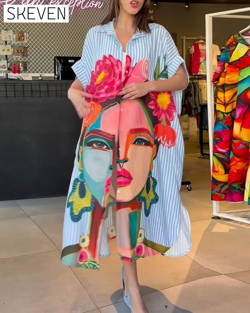 Bluse mit vertikalen Streifen und Charakterprint, Reversschlitz