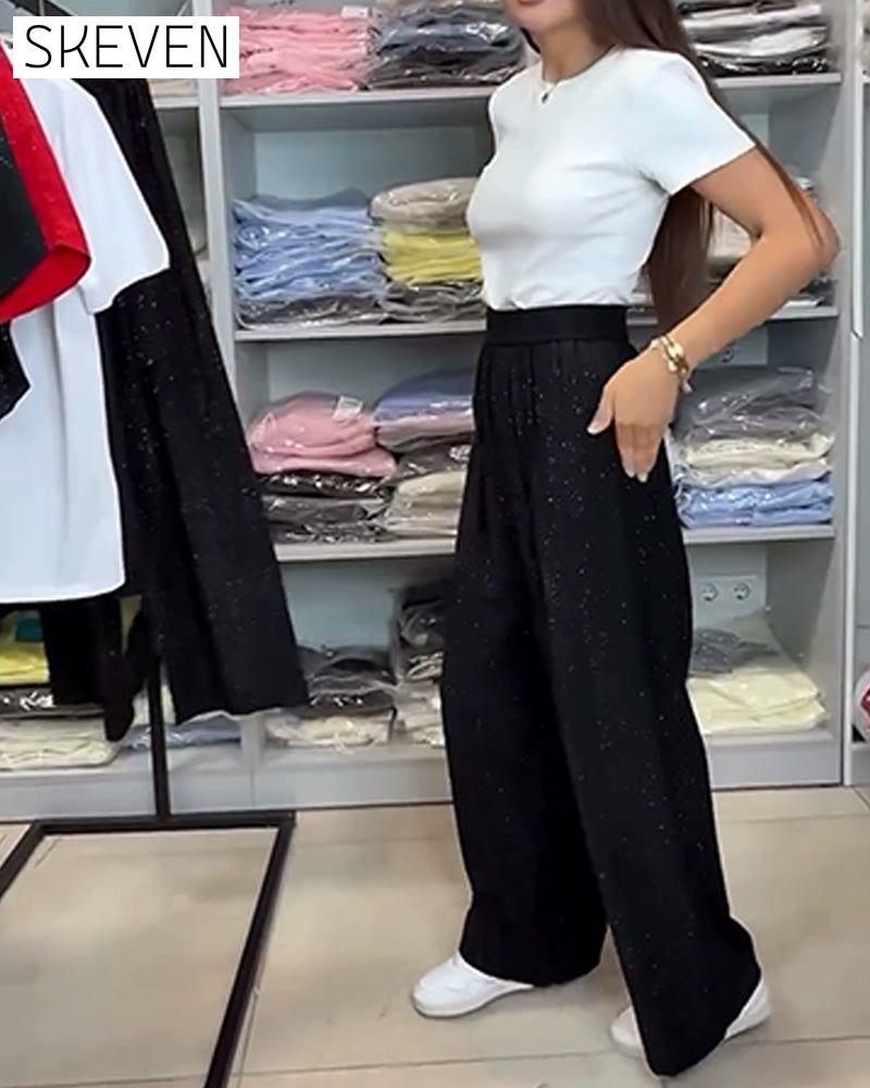 Pantalon élégant à taille haute et jambes larges et brillants