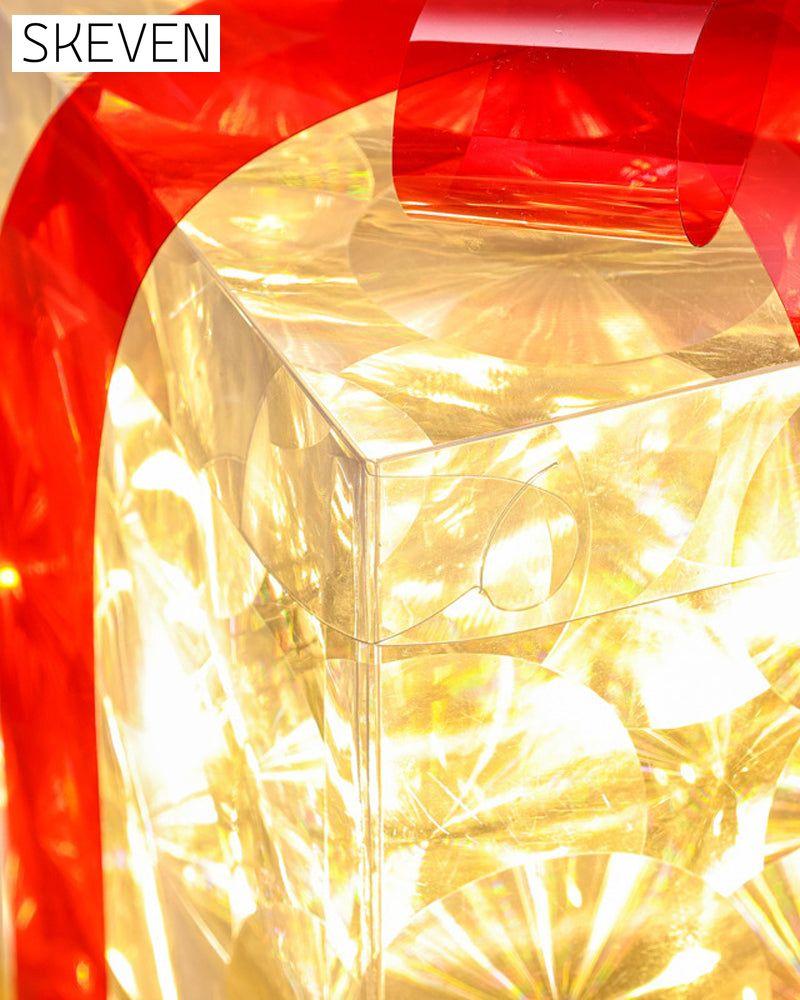 Weihnachtsdekorationen in Form von leuchtenden Geschenkboxen