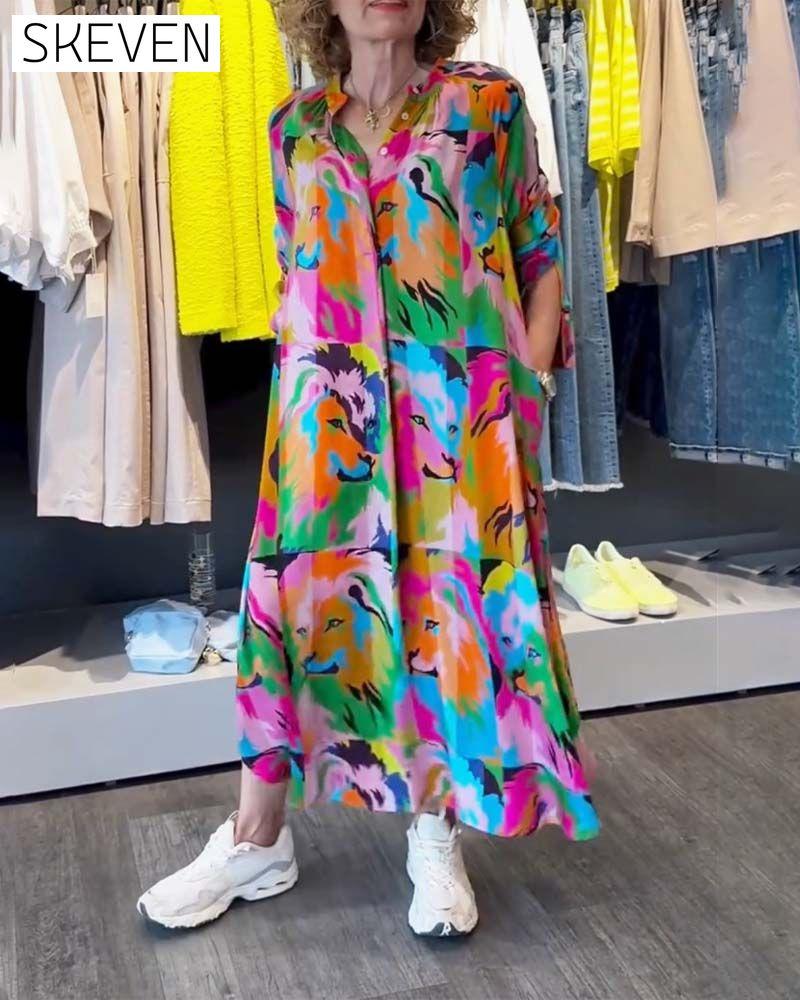 Kleid mit farbigem Aufdruck und Taschen