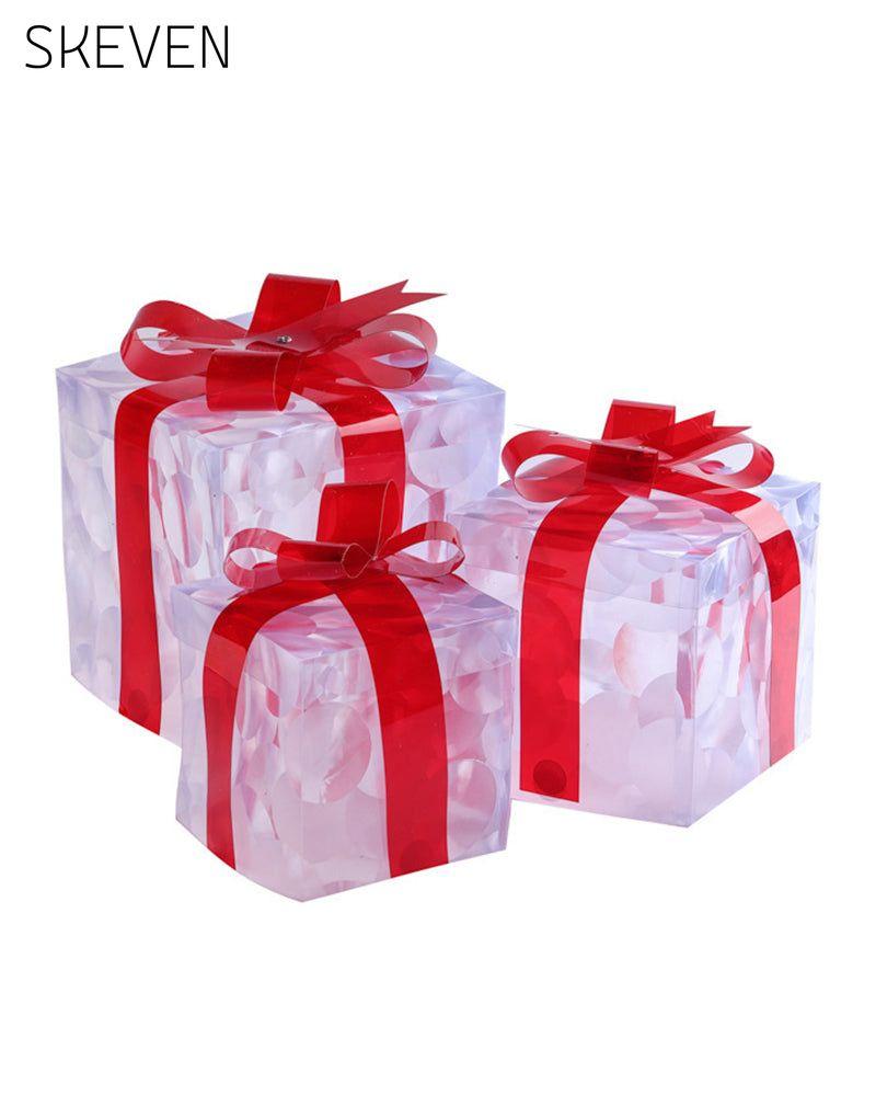 Weihnachtsdekorationen in Form von leuchtenden Geschenkboxen